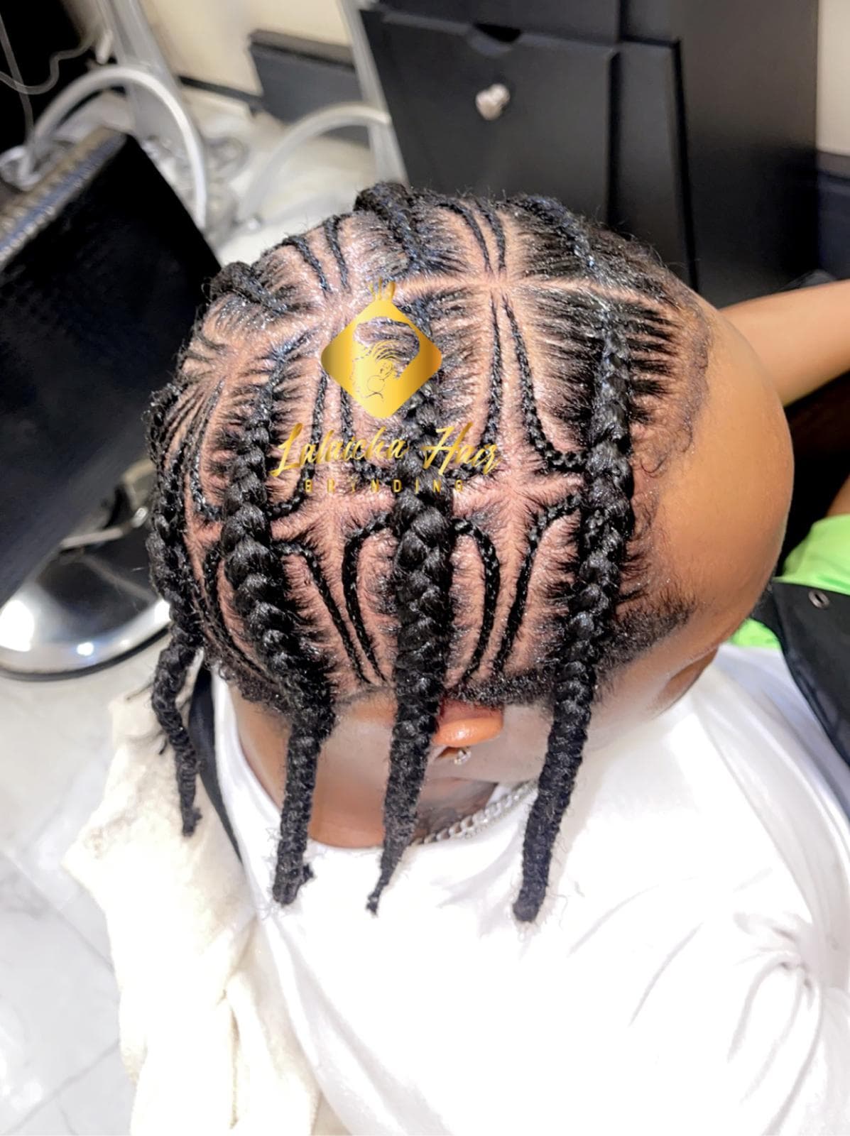 Braided hairstyle by Lalaicha African Hair Braiding